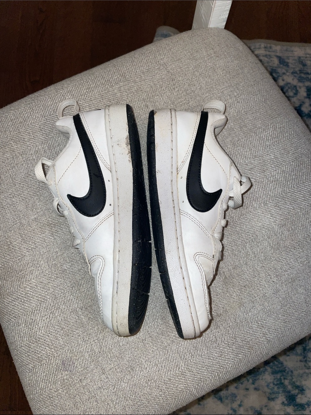 Nike Kids White Sneakers with Black Swoosh Accents